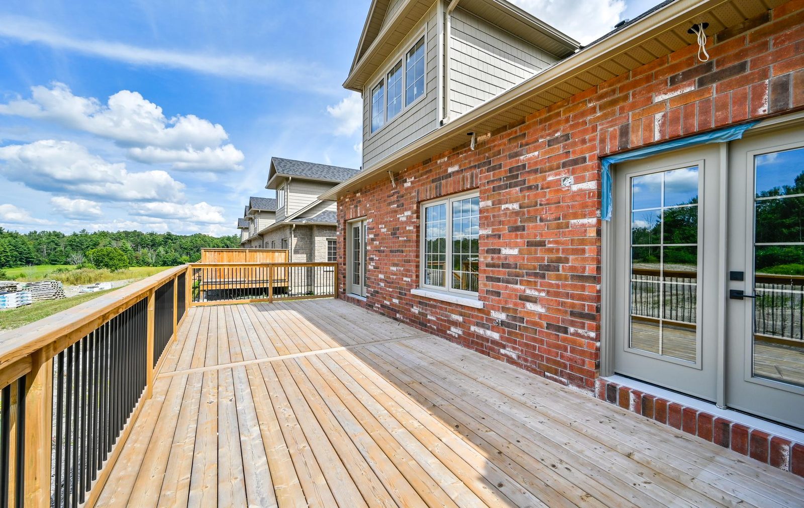 128-134 Orchard Way rear deck with view over the fields
